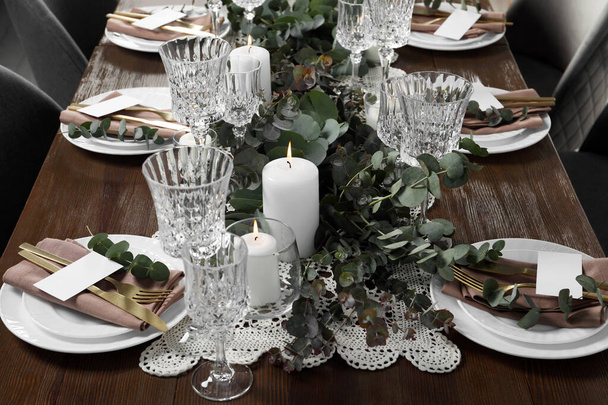 Luxury table setting with beautiful decor and blank cards. Festive dinner - Valokuva, kuva