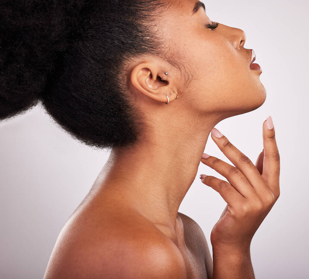 Skincare, cosmetics and profile of black woman with confidence, white background and beauty product. Health, dermatology and natural makeup, African model in studio for healthy skin care and wellness. - Foto, Imagen