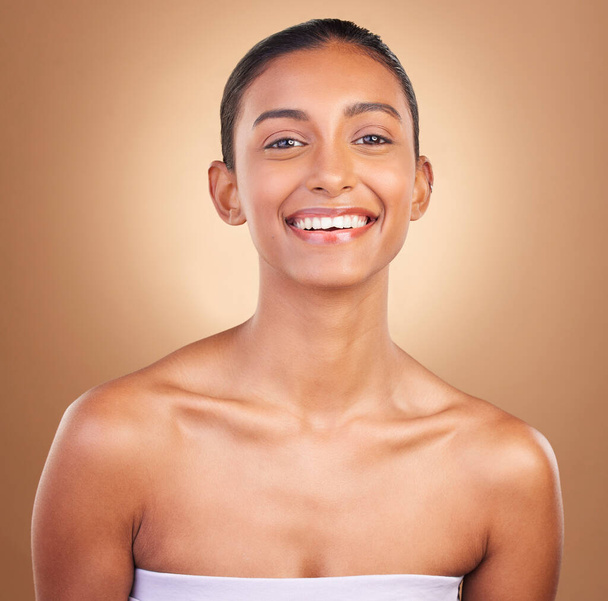 Skincare, smile and portrait of Indian woman for beauty, healthy skin and facial treatment in studio. Dermatology, luxury spa and face of happy girl confident with makeup, cosmetics and wellness. - Photo, image