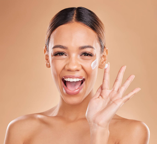 Woman, skincare cream and excited in portrait for beauty, wellness or self care by studio background. Girl, model or happy with cosmetic skin product for natural glow, collagen or dermatology benefit. - Photo, image