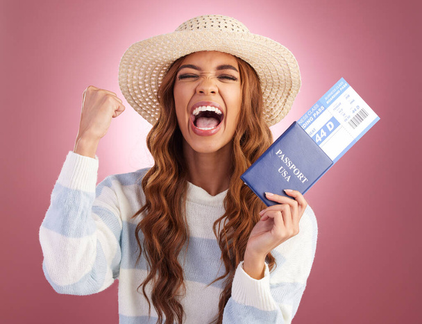 Woman, passport and winner in studio portrait with celebration, celebrate and plane ticket for global immigration. Happy student girl, USA travel documents and shout for freedom, vacation or holiday. - Fotó, kép