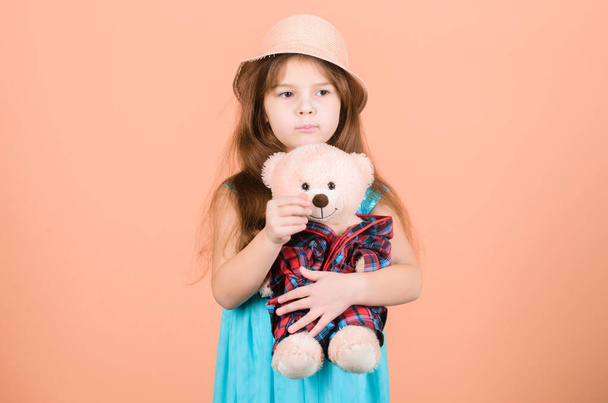 Its my toy. Small child cuddling teddy bear toy. Adorable girl child with cute stuffed animal doll. Little girl holding soft toy. Toy is used in play. - Foto, immagini