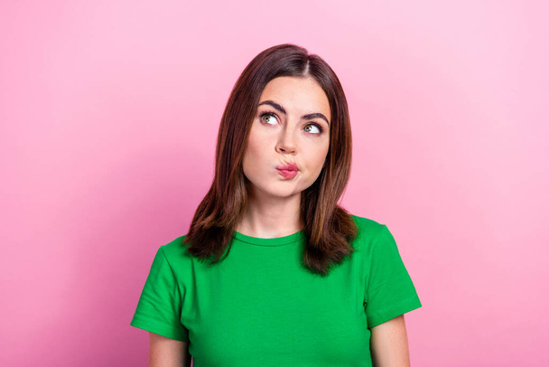 Photo of girlish optimistic nice cute girl with bob hairstyle dressed green t-shirt look empty space isolated on pink color background. - Fotó, kép