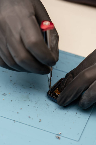 Macro shot - smart watch being repaired by an engineer - Фото, зображення