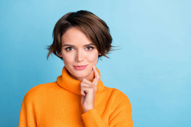 Portrait of pretty nice lady hand finger touch chin empty space isolated on blue color background. - Foto, Bild