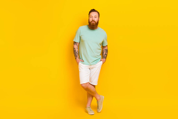 Full length photo of nice attractive young man put hands pockets posing isolated on yellow color background. - Φωτογραφία, εικόνα
