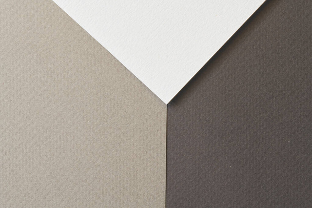 Rough kraft paper background, paper texture different shades of black grey. Mockup with copy space for text - 写真・画像