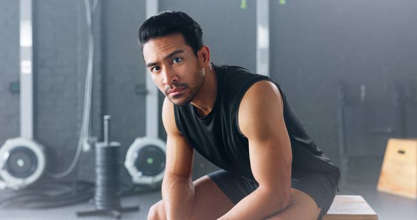Portrait of man, fitness and healthy gym sports muscle training athlete. Young calm Asian male, wellness exercise workout motivation and bodybuilder vision relax in lifestyle health club studio. - Foto, Imagen