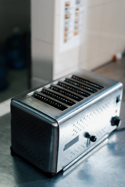 professional kitchen in hotel restaurant with interior kitchen utensils toaster - Фото, изображение