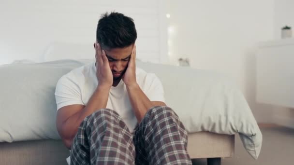 Mental health, anxiety and stress with man in bedroom for frustrated, problem and lonely. Grief, sad and depression issues with guy suffering at home and feeling failure, struggle and burnout. - Footage, Video