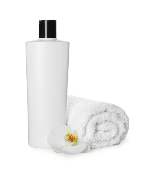 Bottle of shampoo and terry towel on white background - Zdjęcie, obraz