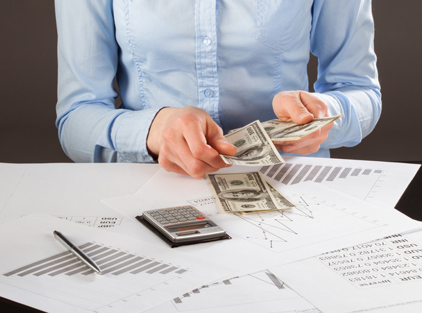 Business accountant working with documents and money - 写真・画像