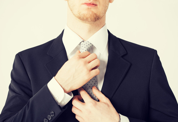 man adjusting his tie - Φωτογραφία, εικόνα