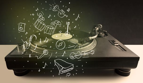 Turntable playing classical music with icon drawn instruments  - Фото, зображення