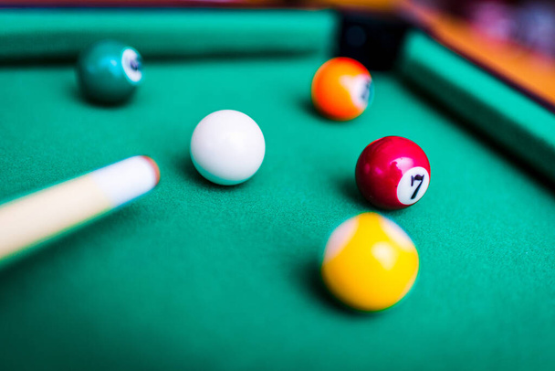 Billiard snooker balls composition on the green pool table. Gambling game of Billiards. - Photo, Image