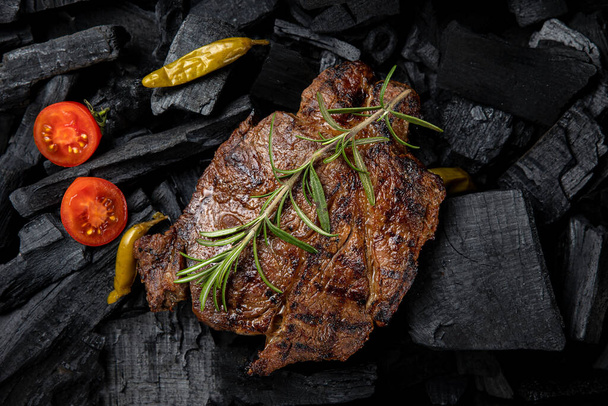 steak on a black  background. Top view.  - 写真・画像