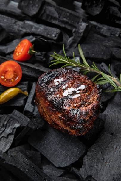 steak on a black  background. Top view.  - Fotoğraf, Görsel