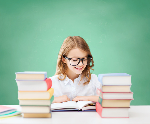 happy student girl reading book at school - Фото, изображение