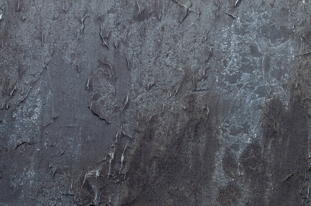 Textur einer alten Mauer in einem dunklen Farbton - Foto, Bild