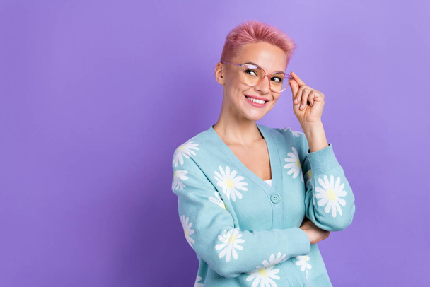 Photo of funny gorgeous woman with short hairstyle dressed blue cardigan hold glasses look empty space isolated on purple color background. - Valokuva, kuva