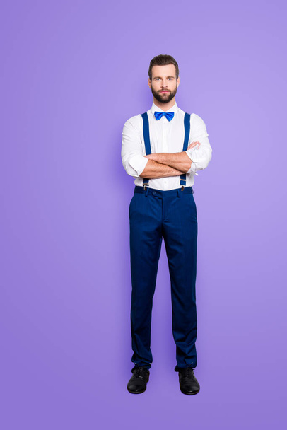 Full size full body portrait of famous talented singer in blue ourfit, wearing bow, white shirt, suspenders, isolated over grey background, holding arms crossed. - Φωτογραφία, εικόνα