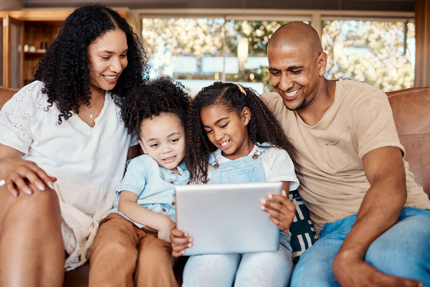 Tablet, happy family and kids with online video, movies or cartoon together for love, learning or bonding. Biracial mother, father and children watch film, show and relax on digital tech for holiday. - Photo, Image