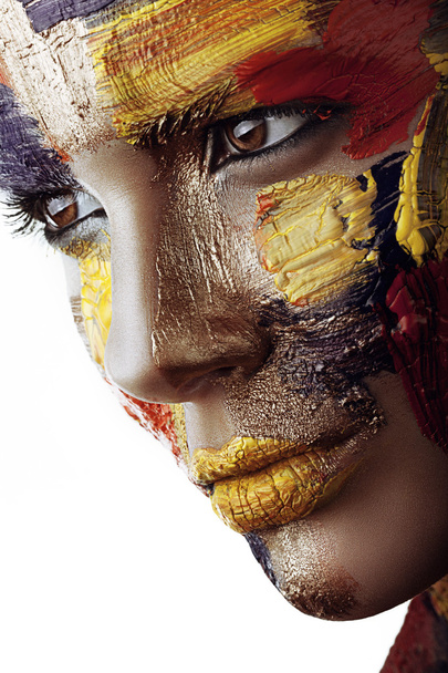 Woman with paint on face - Fotoğraf, Görsel