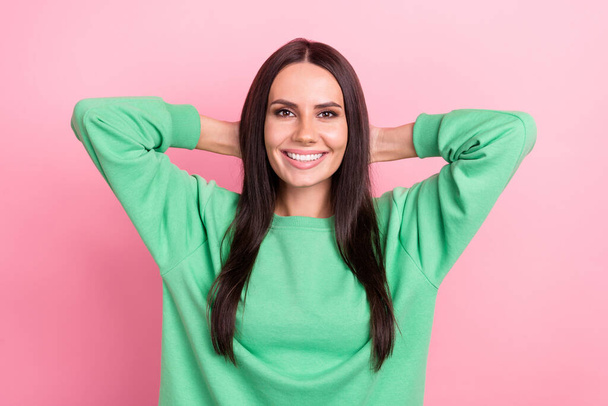 Photo of attractive young relaxed lady hands head take nap after hard working day comfort wear green jumper isolated on pink color background. - Fotoğraf, Görsel