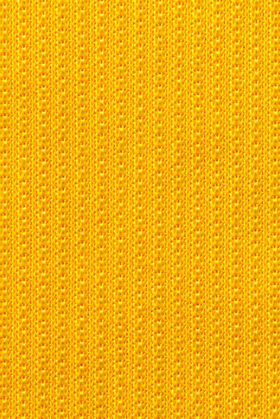 Yellow color sports clothing fabric football shirt jersey texture and textile background. - Фото, зображення