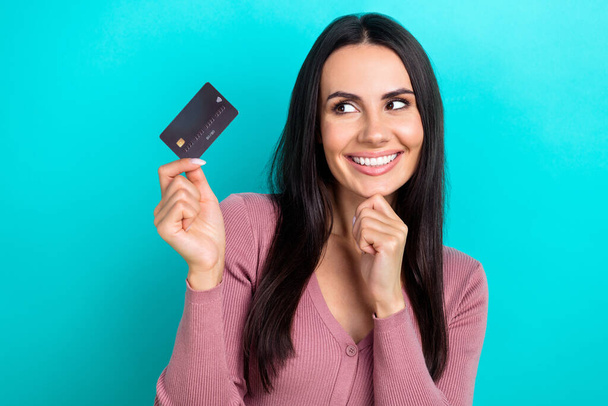Portrait photo of young promoter optimistic woman smile visa mastercard debit card new terms high percent cashback isolated on blue color background. - Фото, изображение