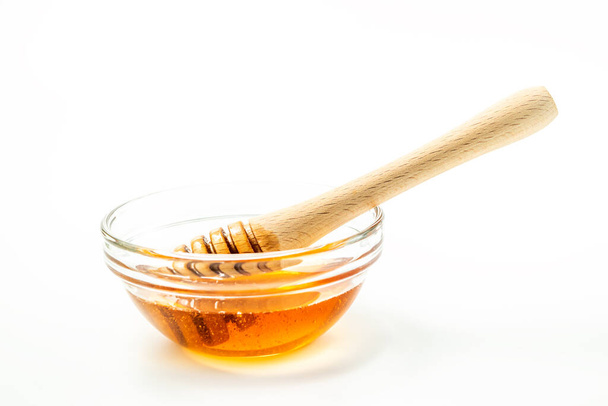 Honey bowl and dipper isolated on white background as package design element - Photo, Image