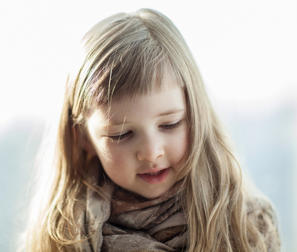 Closeup portrait of a beautiful little girl - Фото, изображение
