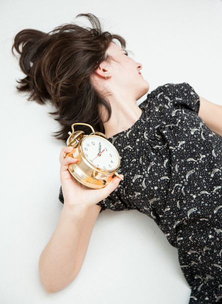 Woman sleeping with an alarm clock - Φωτογραφία, εικόνα
