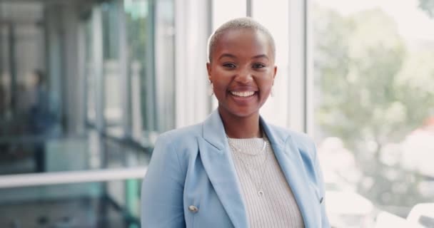 Face, portrait of black woman employee in an office building with a happy smile, vision or goals for success. Business office, leadership or marketing manager with pride, growth mindset or experience. - Záběry, video