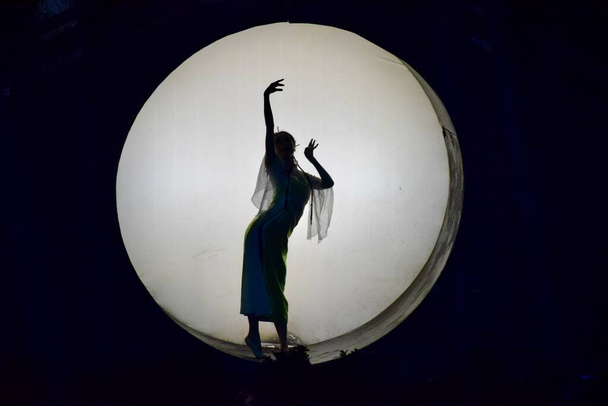 Performer in Silhouette at The Song Dynasty Show. Hangzhou, Zhejiang, China. October 28, 2018.  - Фото, изображение