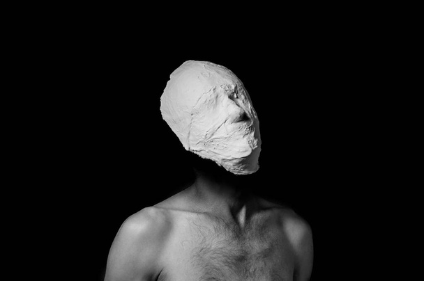 black and white photo of a man in a plaster mask - Φωτογραφία, εικόνα