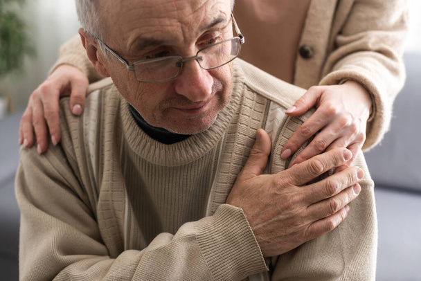 Hands of an elderly man holding the hand of a younger woman. - Φωτογραφία, εικόνα
