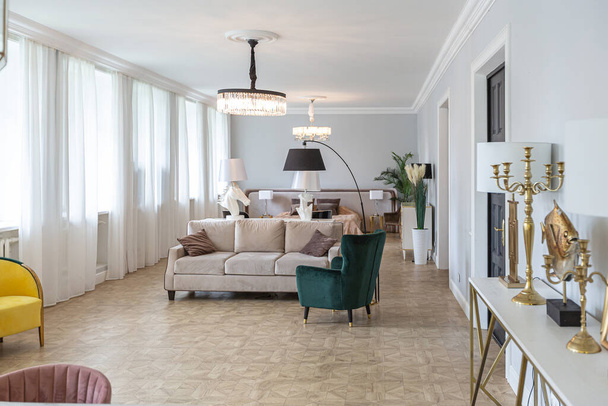 luxury interior of a modern apartment in bright colors with stylish furniture. kitchen, bedroom and living room area without walls. - Zdjęcie, obraz
