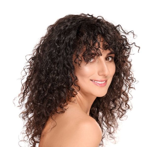Beautiful young woman with long curly hair on white background - Φωτογραφία, εικόνα
