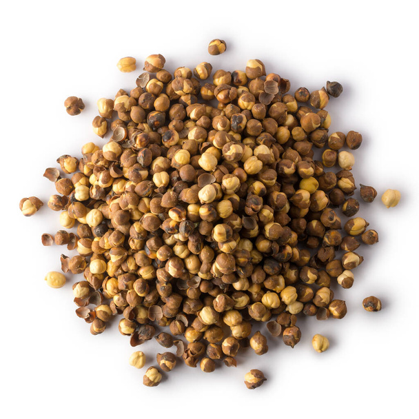 pile of roasted and salted black chickpeas, also known as bengal gram or desi chickpea, traditional and native oil free snack of india isolated on white background, taken from above - Photo, image