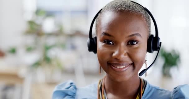 Telemarketing, face and happy black woman with a smile from customer support work. Call centre, crm and web help consultant with happiness from professional consulting with blurred background. - Filmmaterial, Video