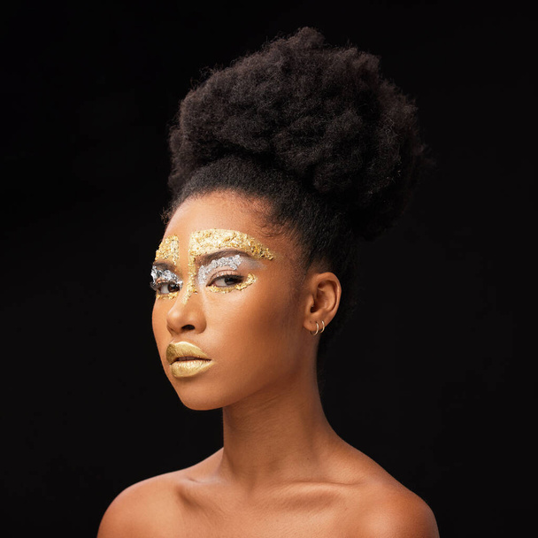 Beauty, gold and portrait with black woman and makeup in studio for luxury, cosmetics and African pride. Natural, creative and goddess with female model on background for queen, bronze and glamour. - Photo, Image