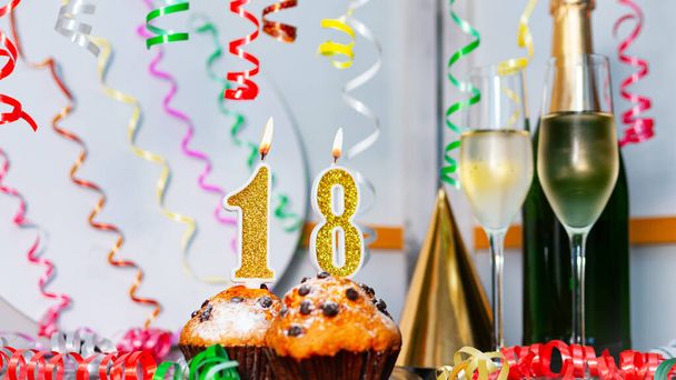 Solemn cake for an anniversary with a number  18. Happy birthday background with champagne bottle and champagne glasses. Beautiful holiday decorations copy space. - Zdjęcie, obraz