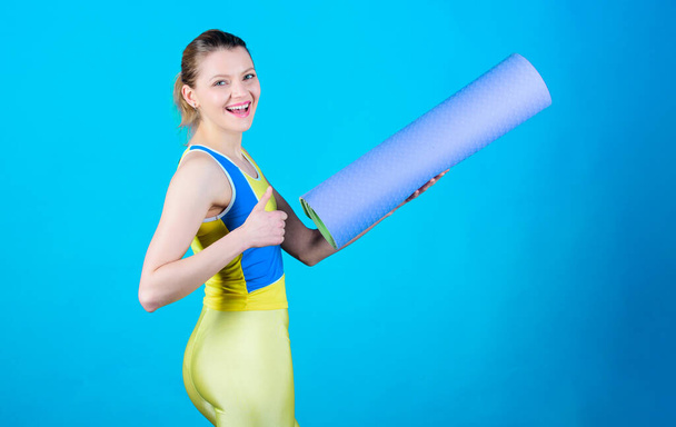 Doing yoga. Sport mat equipment. Athletic fitness. Sporty woman training in gym. Strong muscles and power. Health diet. Success. Happy woman workout with fitness mat. Mind and body in harmony. - Photo, Image