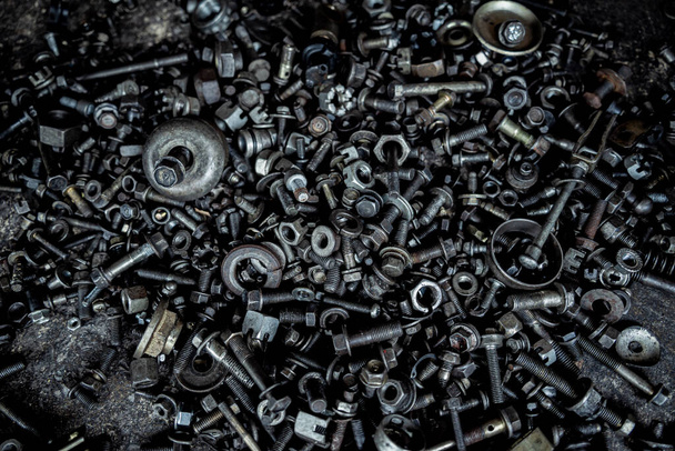 Abstract background with metal nuts and bolts. - Photo, Image