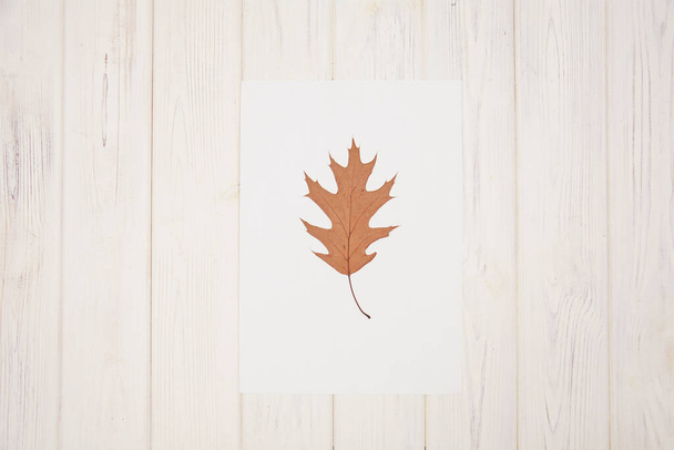autumn leaves on a wooden background - Фото, изображение