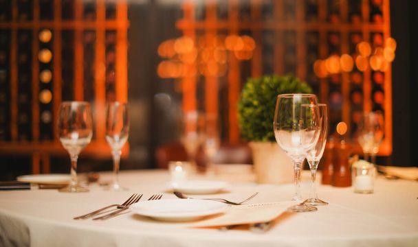 table setting with white wine glasses and cutlery - Valokuva, kuva