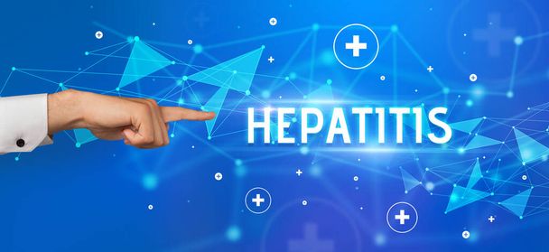 Close-Up of cropped hand pointing at HEPATITIS inscription, medical concept - Photo, Image