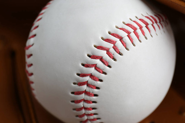 Leather baseball glove with ball, closeup. Sportive equipment - Foto, Bild