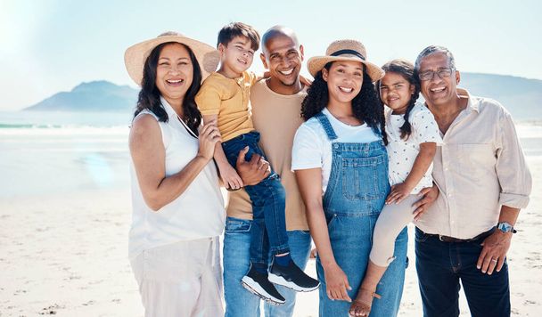 Portrait, beach and black family bonding in nature outdoor together on vacation during summer. Happy, smile or love with children, parents and grandparents on the coast or shore for a holiday. - Foto, Imagen